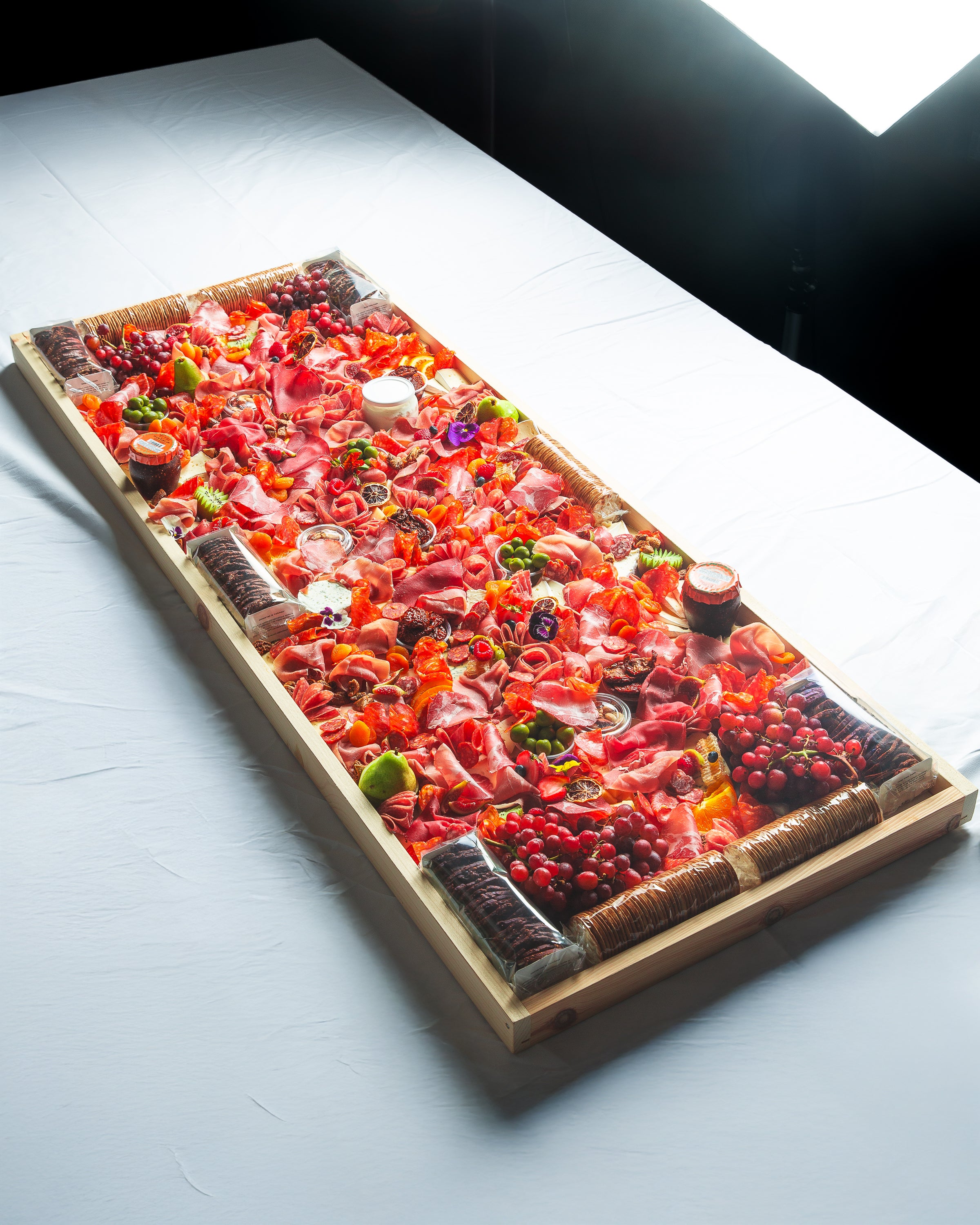 Overhead of 5 foot charcuterie board by The Graze Anatomy 