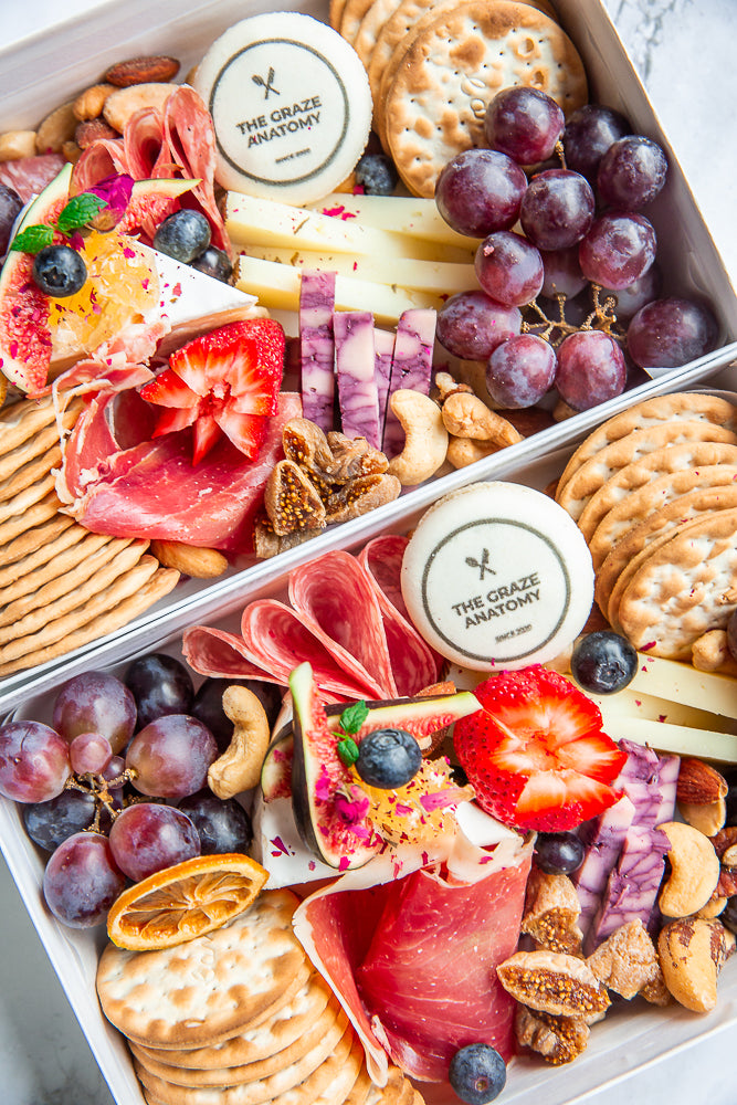 2 Mini charcuterie boxes by The Graze Anatomy. 